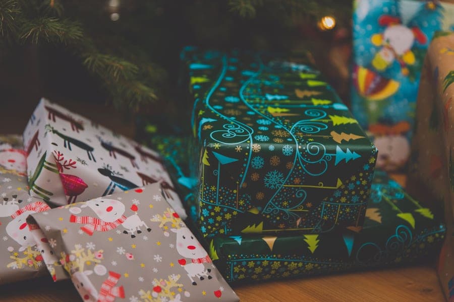 Wrapped presents under a decorated Christmas tree