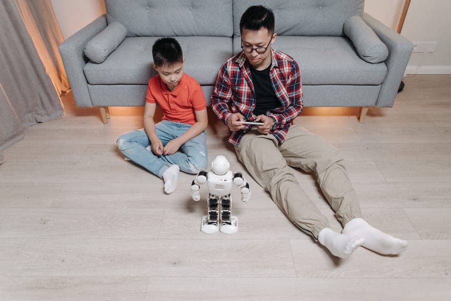 An adult and a child using a remote control together